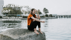 job vulnerability is something many are feeling, but is it necessary? A lady sat on a large rock as she looks out to sea in thought