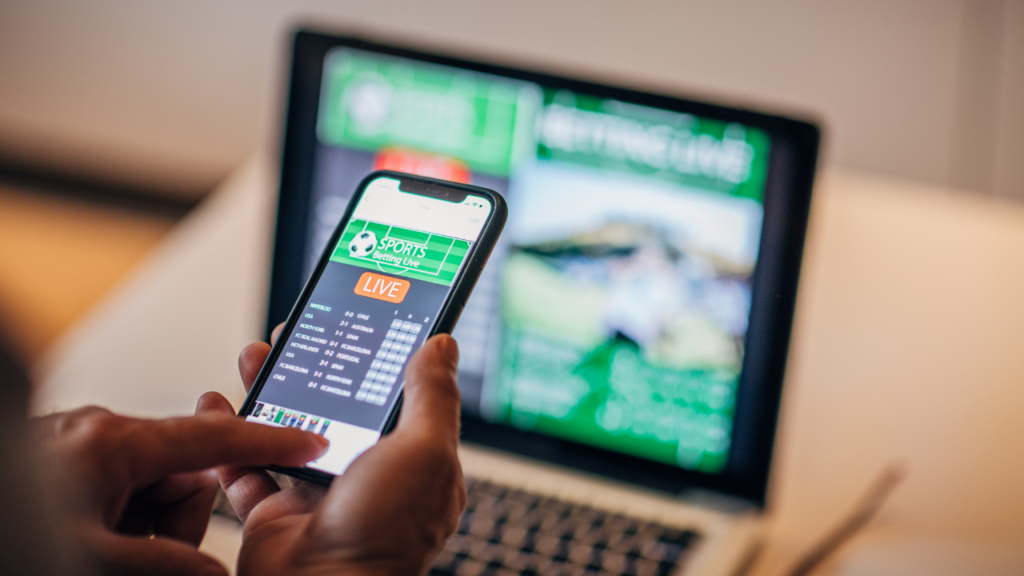 Staying ahead of the gambling act review - someone gambling on their phone